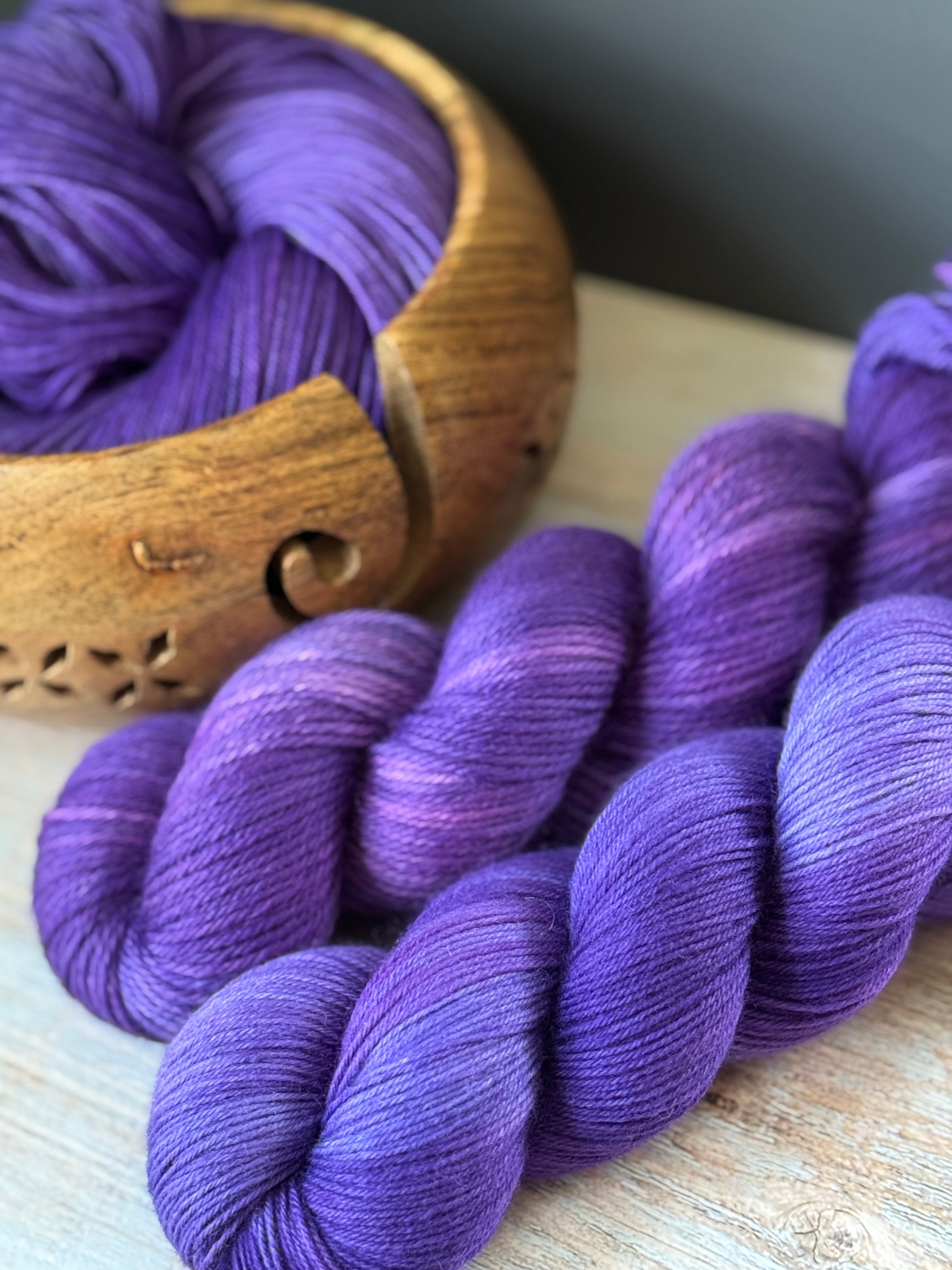 Three skeins of purple yarn