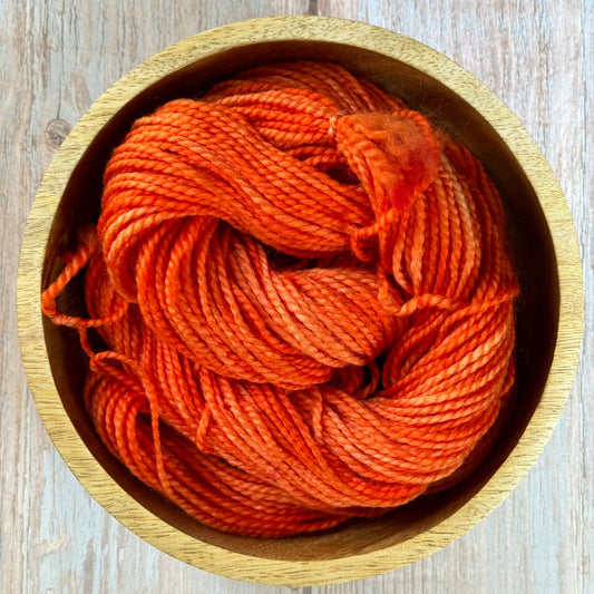 Orange Yarn in a wooden bowl