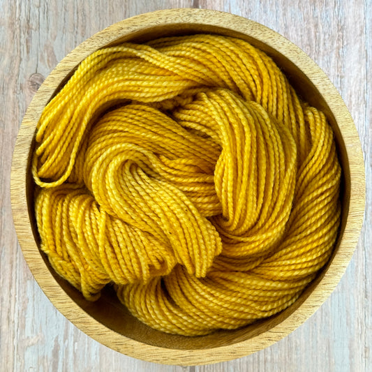 Yellow Yarn in a wooden bowl