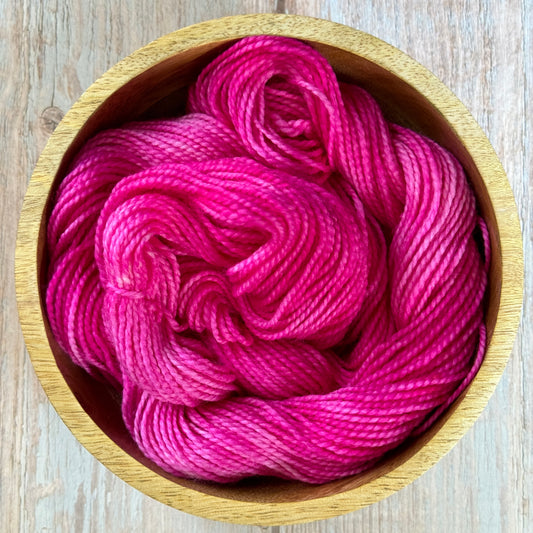 Pink Yarn in a wooden bowl